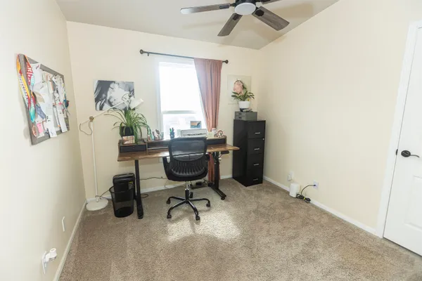 a bedroom with a bed window and couch