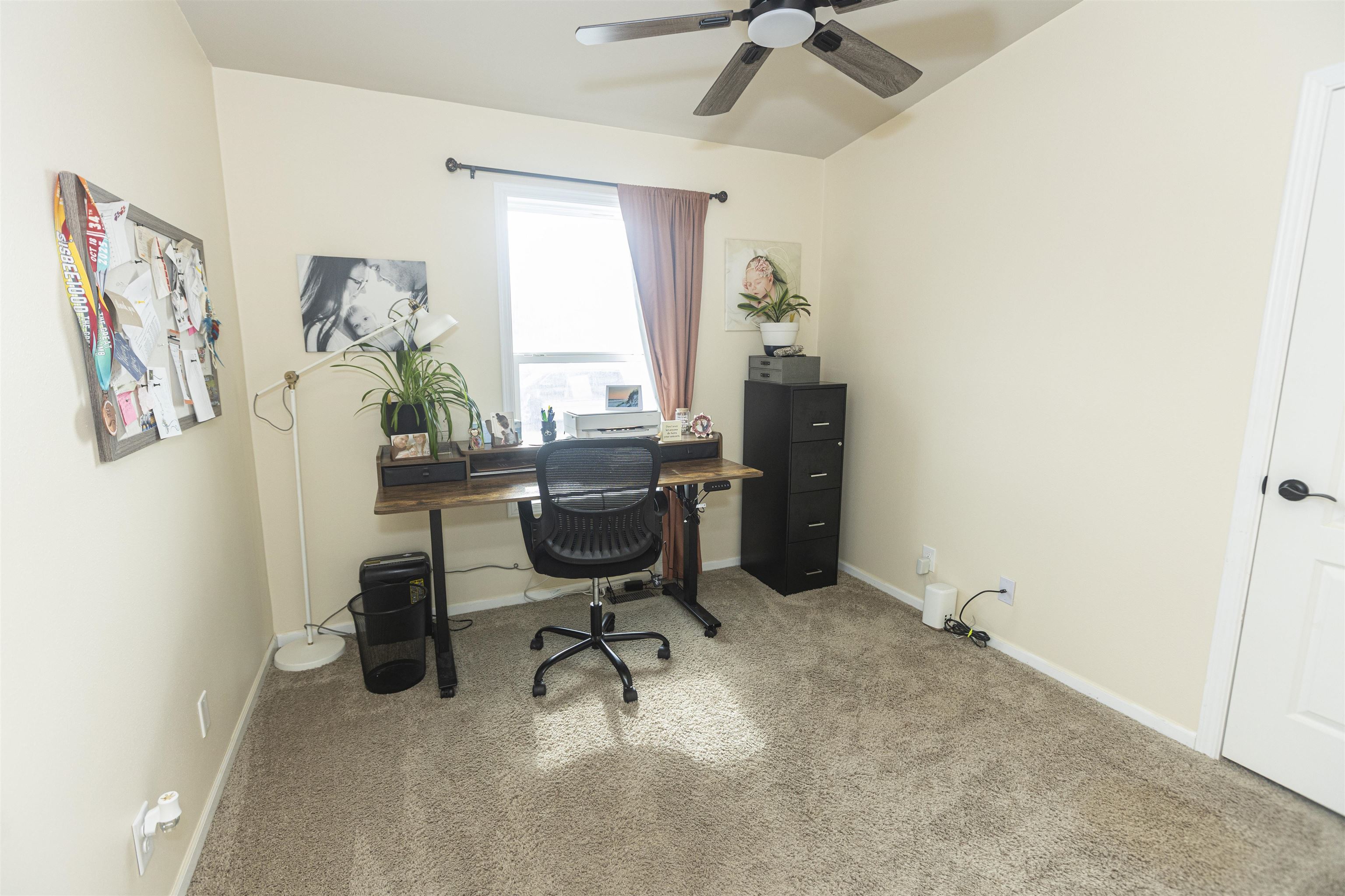 2432 Pioneer Way Rifle, CO 81650 - Photo 16 of 28 a view of a workspace with furniture and a window