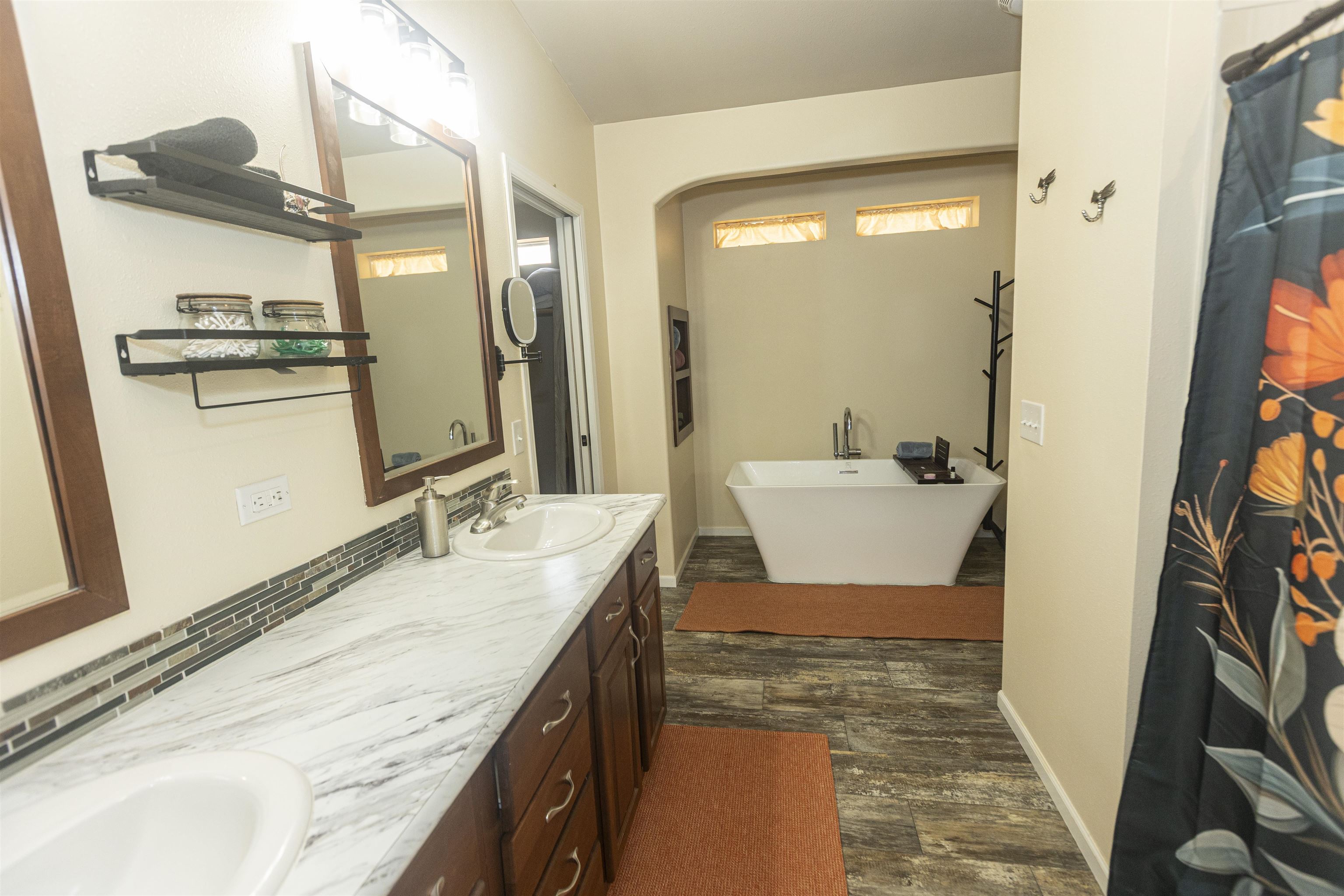 2432 Pioneer Way Rifle, CO 81650 - Photo 19 of 28 a bathroom with a granite countertop sink a mirror and a shower