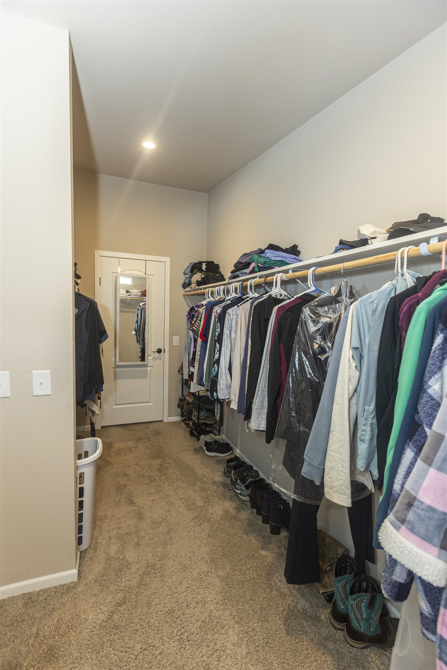 2432 Pioneer Way Rifle, CO 81650 - Photo 20 of 28 a view of walk in closet with clothes and shoes