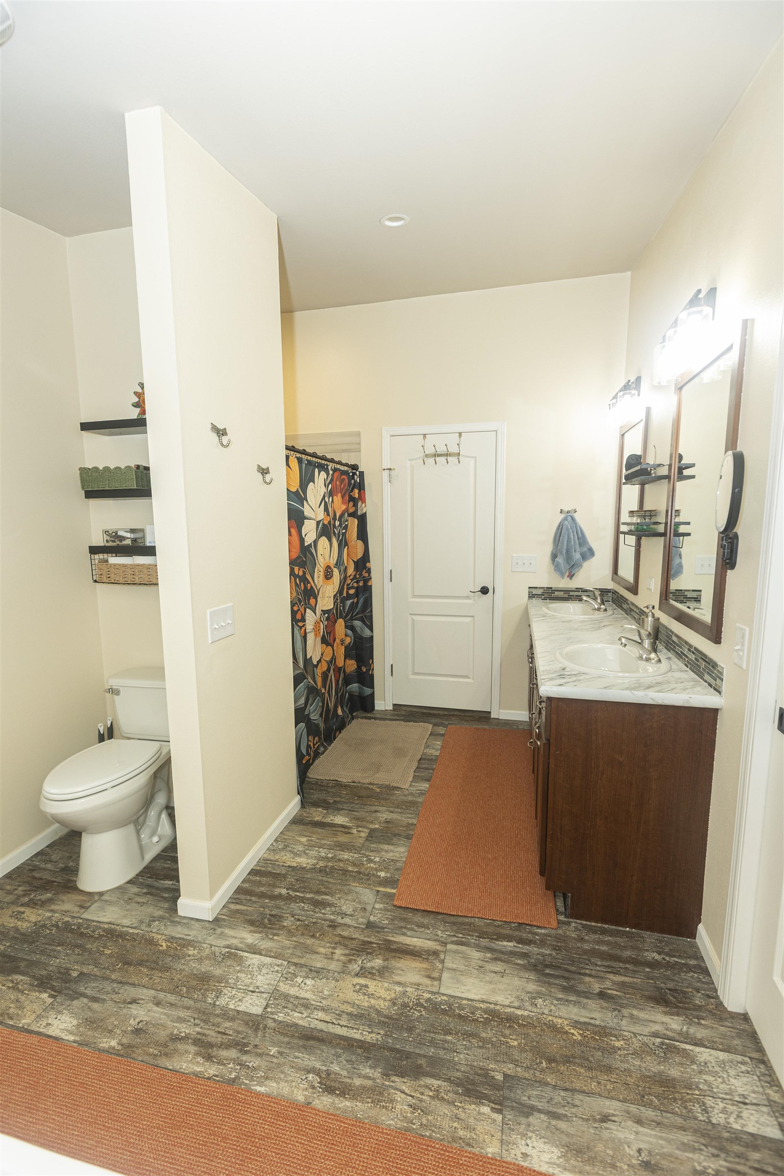 2432 Pioneer Way Rifle, CO 81650 - Photo 22 of 28 a bathroom with a granite countertop sink a toilet and a shower