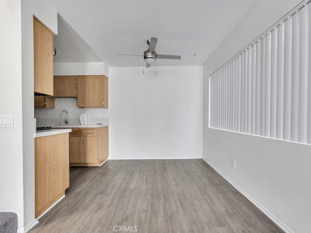 14218 Victory Boulevard Van Nuys, CA 91401 - Photo 8 of 16 a view of a kitchen with a sink cabinets and wooden floor