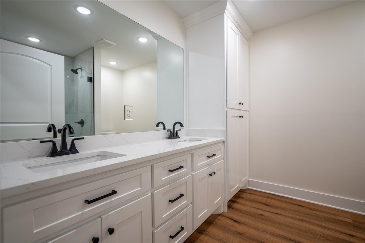 3987 Buffalo Road Summertown, TN 38483 - Photo 21 of 26 a bathroom with a double vanity sink and a mirror