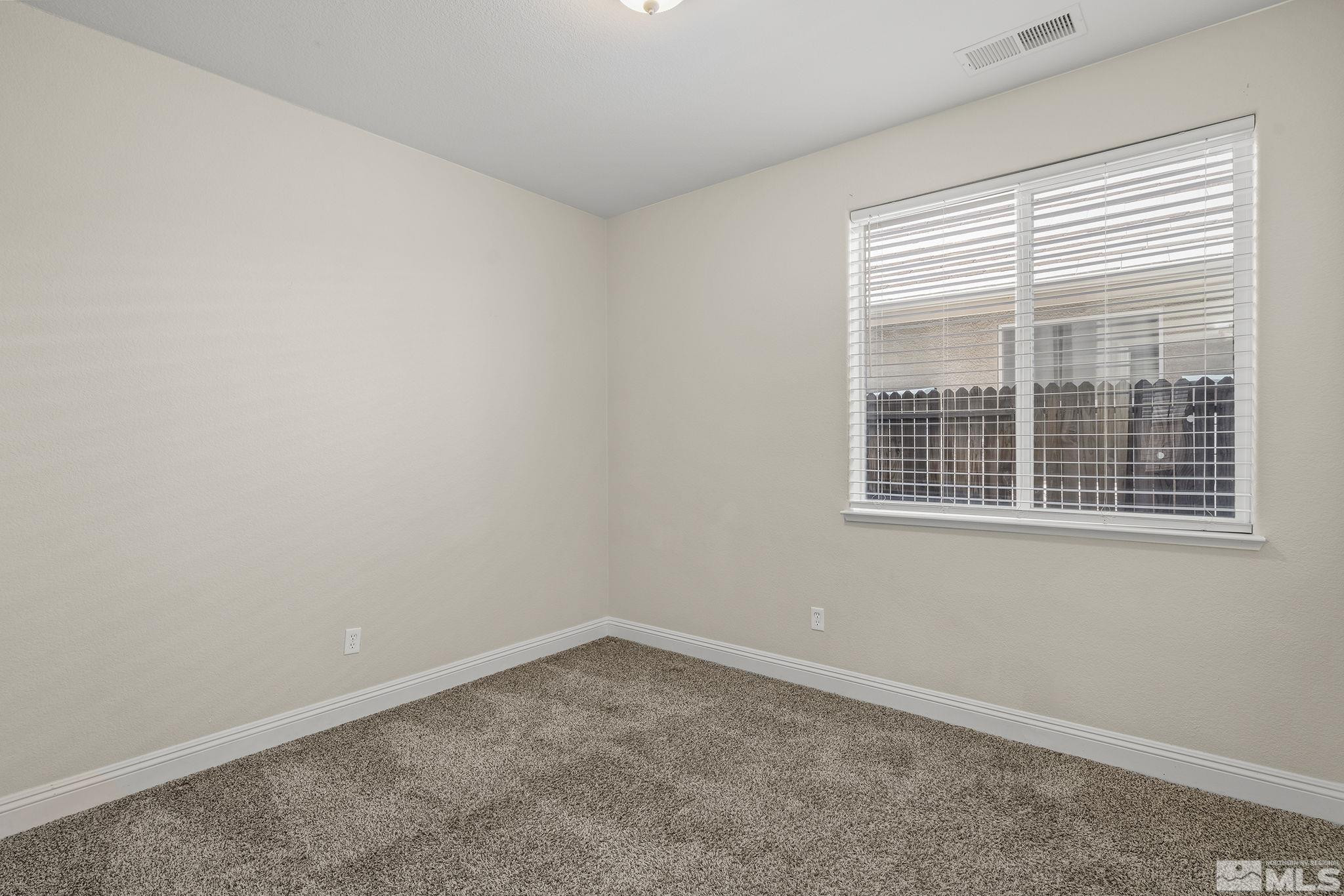 1755 Cavern Drive Reno, NV 89521 - Photo 11 of 25 an empty room with a window