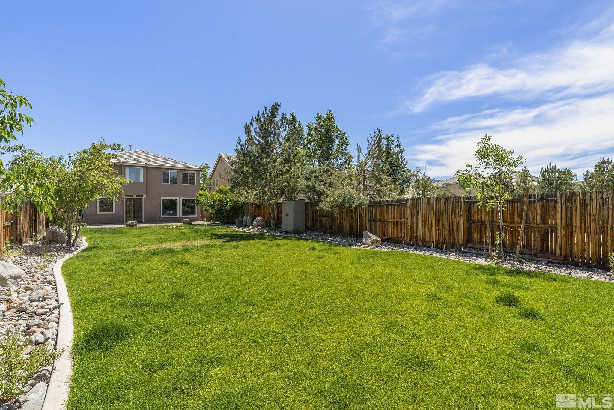 1755 Cavern Drive Reno, NV 89521 - Photo 2 of 25 a front view of a house with yard and green space