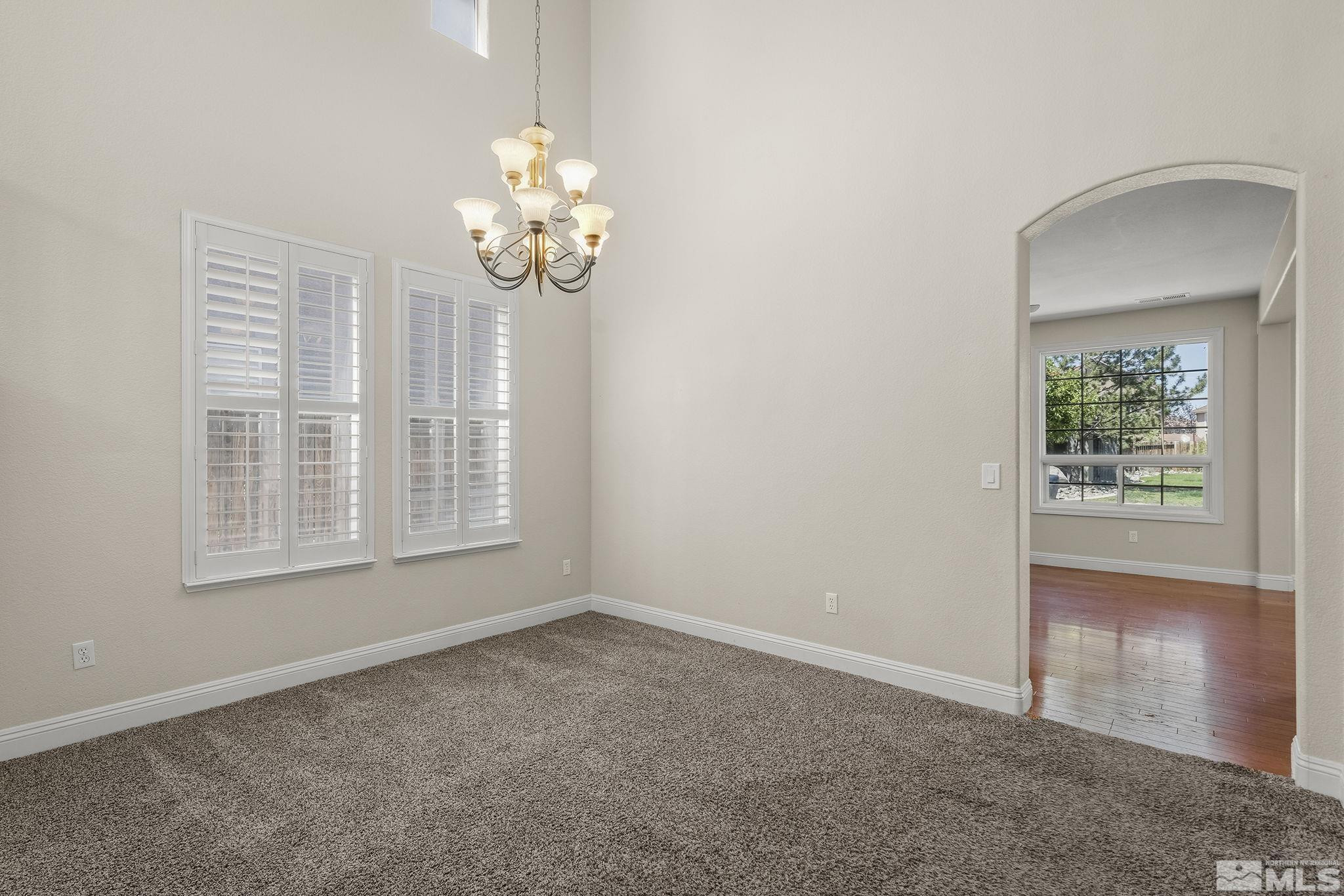 1755 Cavern Drive Reno, NV 89521 - Photo 22 of 25 an empty room with windows and entrance