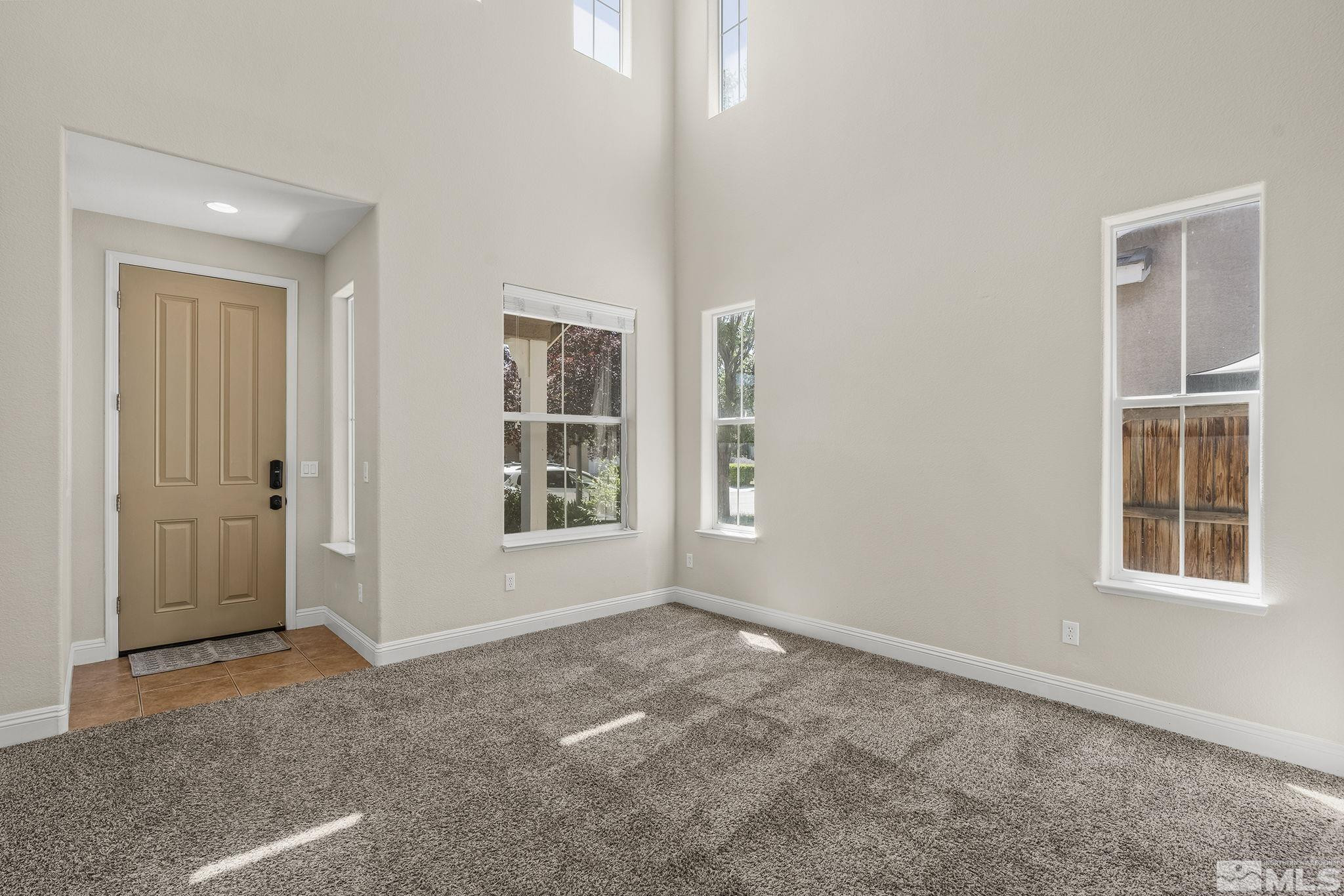 1755 Cavern Drive Reno, NV 89521 - Photo 23 of 25 an empty room with windows