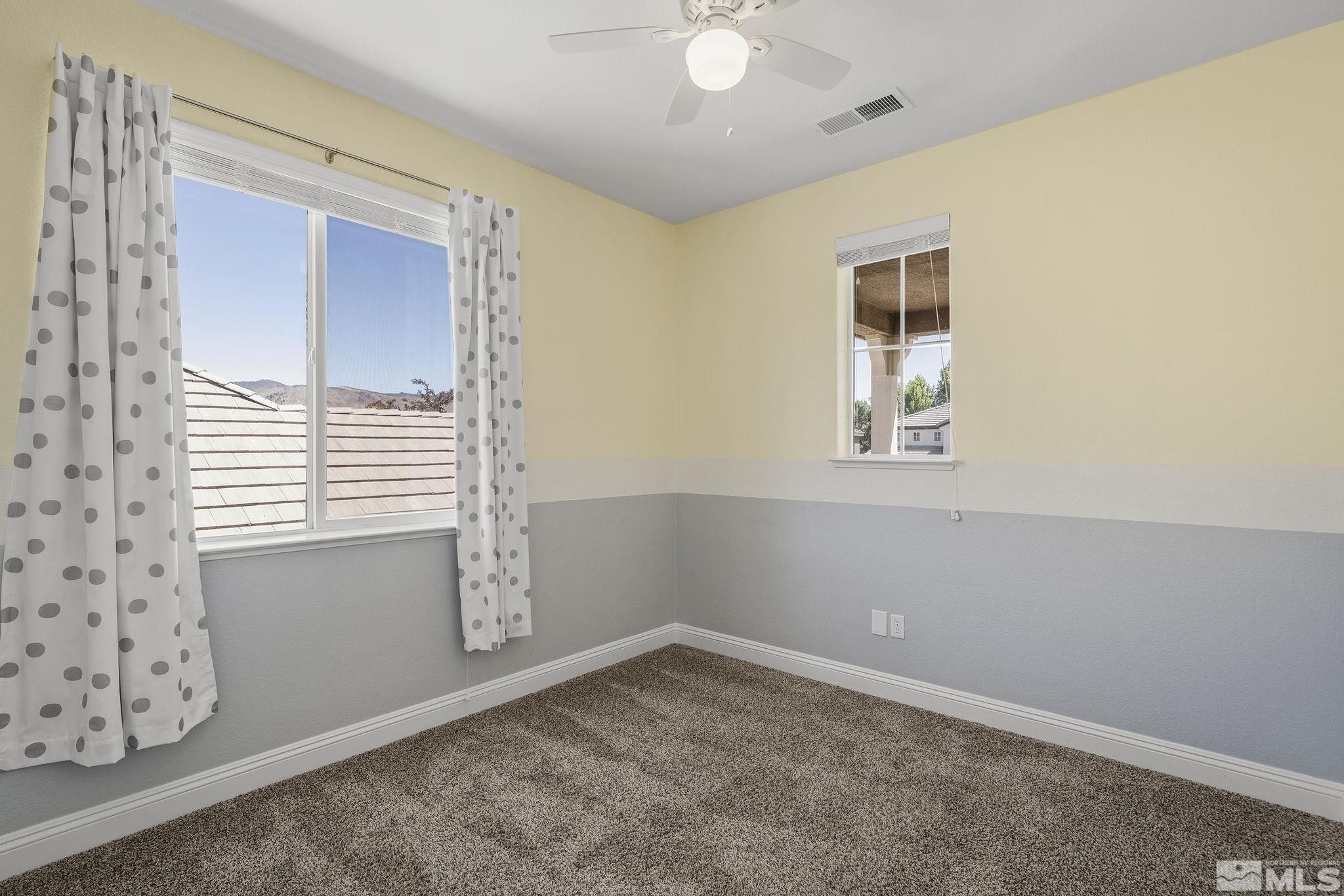 1755 Cavern Drive Reno, NV 89521 - Photo 8 of 25 an empty room with windows