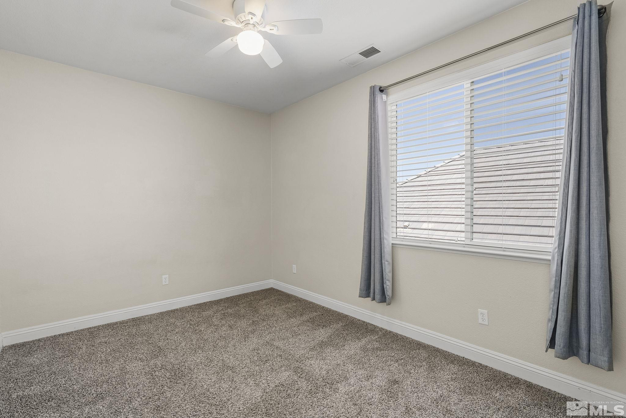 1755 Cavern Drive Reno, NV 89521 - Photo 9 of 25 an empty room with a window