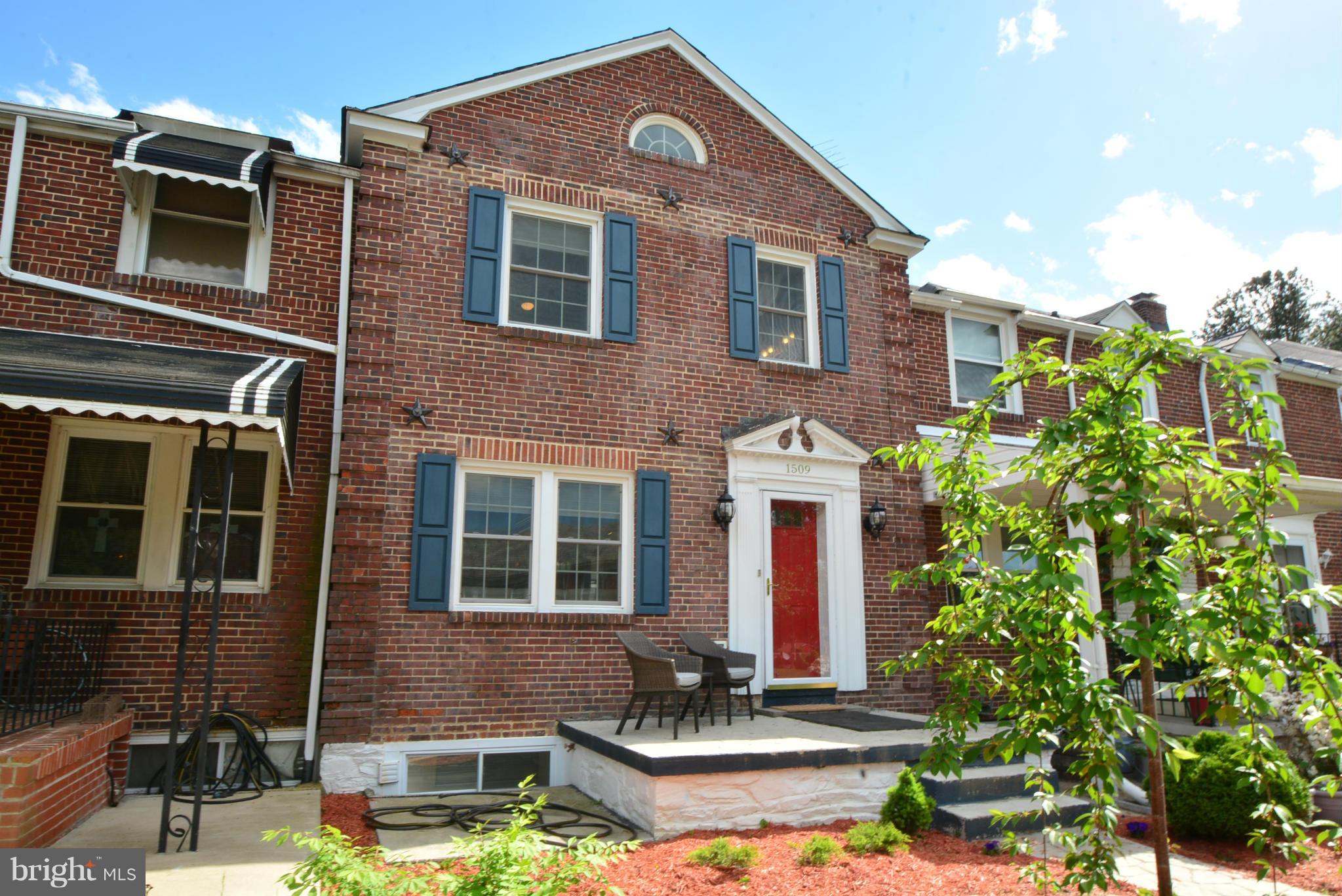 1509 Lochwood Road Baltimore, MD 21218 - Photo 1 of 30 a front view of a house with a yard