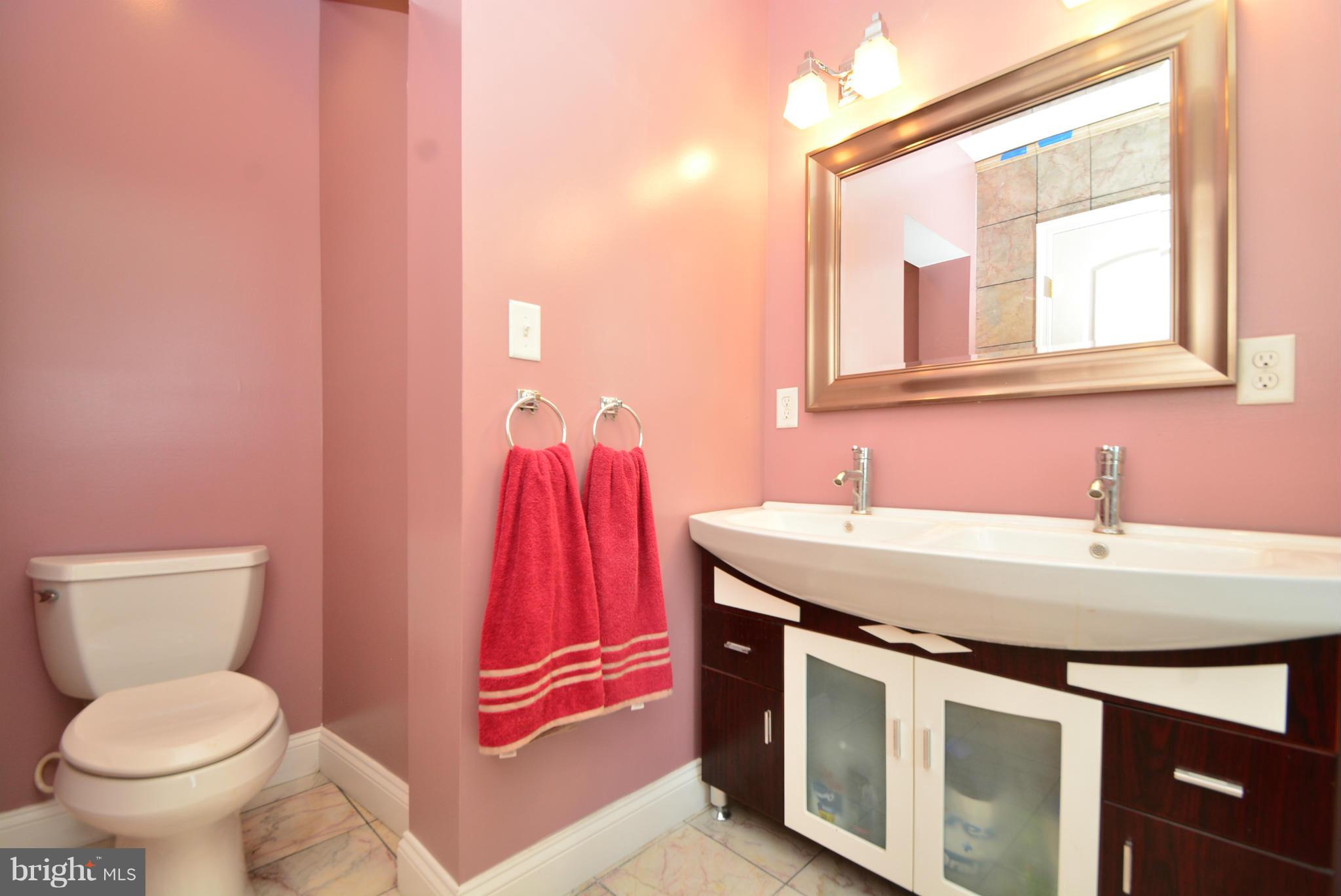 1509 Lochwood Road Baltimore, MD 21218 - Photo 16 of 30 a bathroom with a sink and a toilet