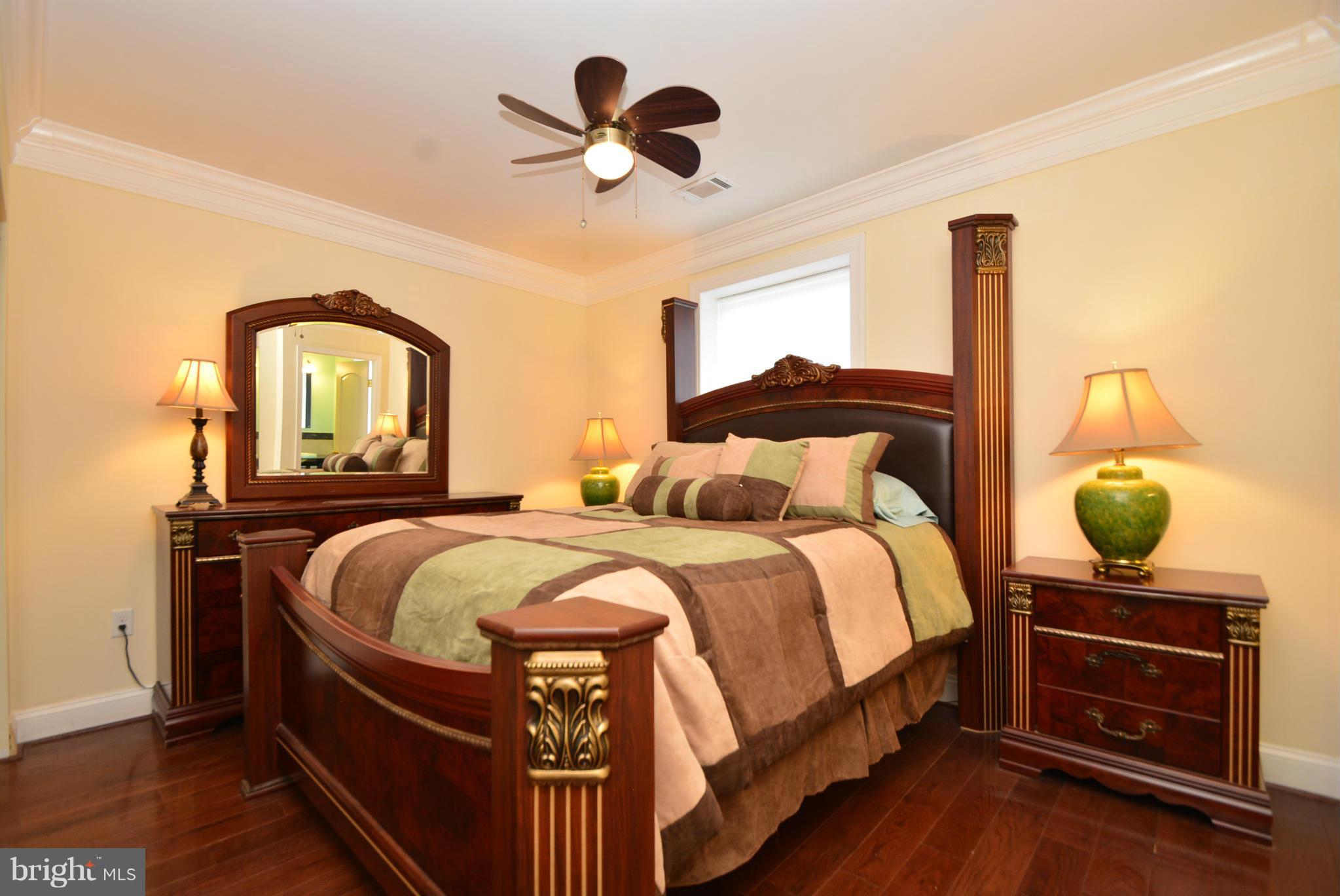 1509 Lochwood Road Baltimore, MD 21218 - Photo 17 of 30 a bedroom with bed and a window