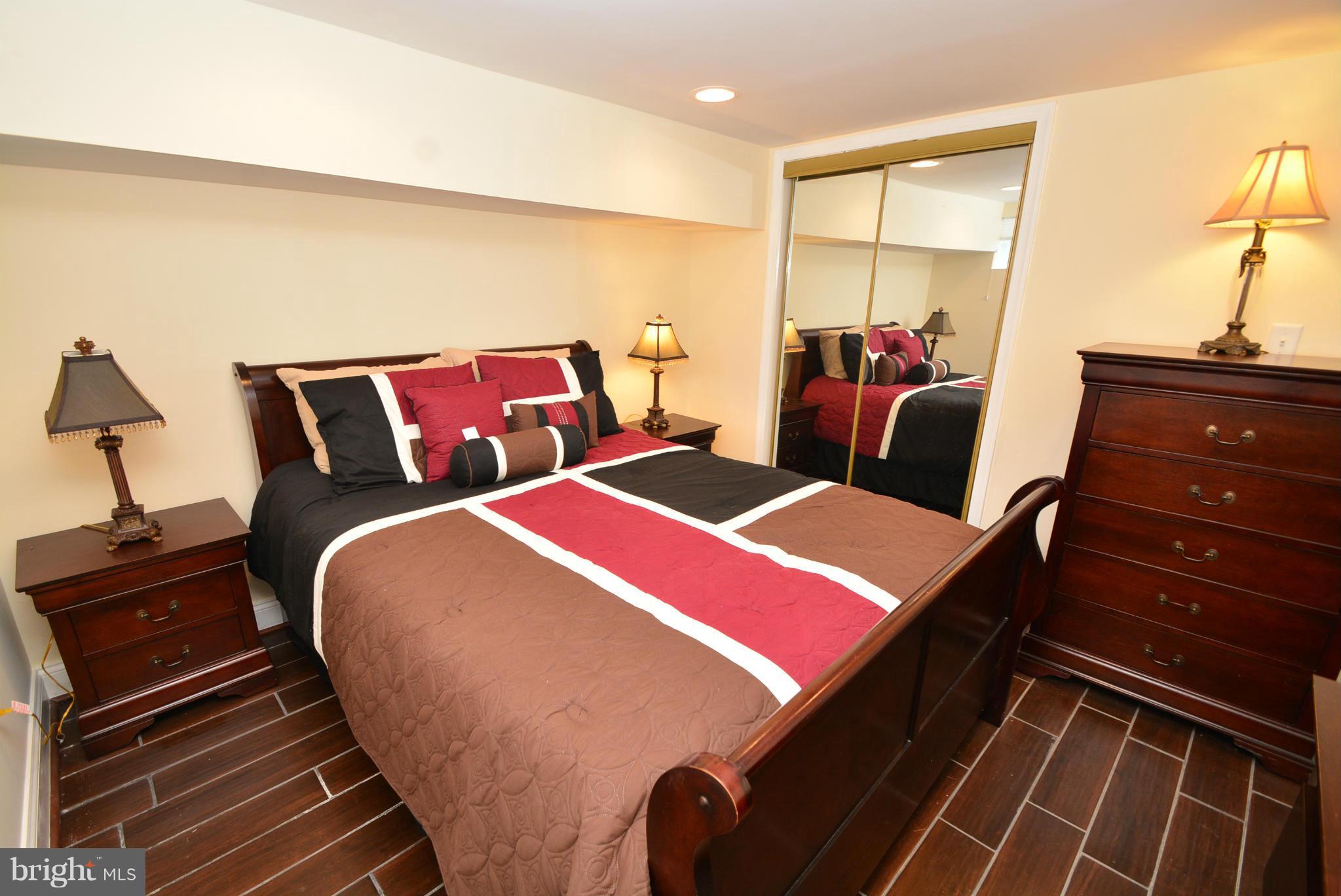 1509 Lochwood Road Baltimore, MD 21218 - Photo 20 of 30 a bed room with two bed and a night stand