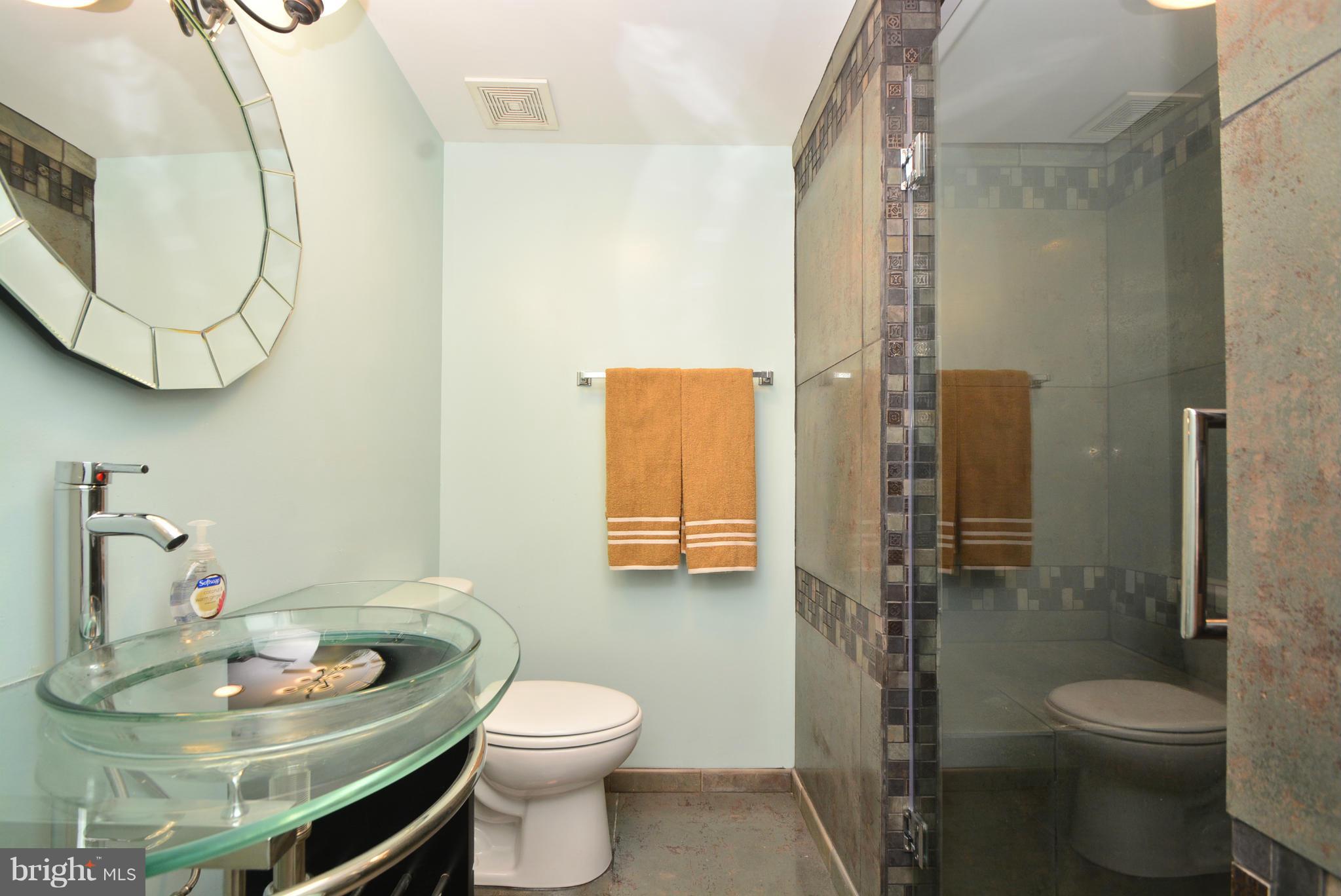 1509 Lochwood Road Baltimore, MD 21218 - Photo 22 of 30 a bathroom with a sink toilet and shower