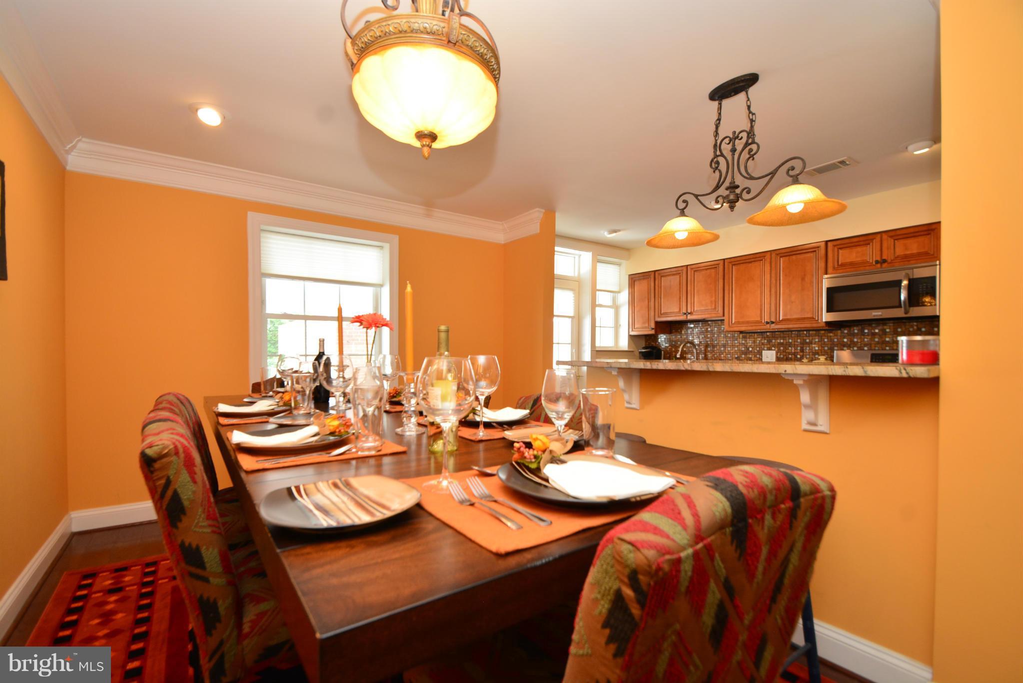 1509 Lochwood Road Baltimore, MD 21218 - Photo 6 of 30 a dining room with a table and chairs