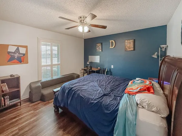 a bedroom with bed and a window