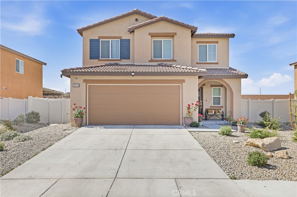 10143 Colten Ridge Adelanto, CA 92301 - Photo 1 of 36 a front view of a house with garden