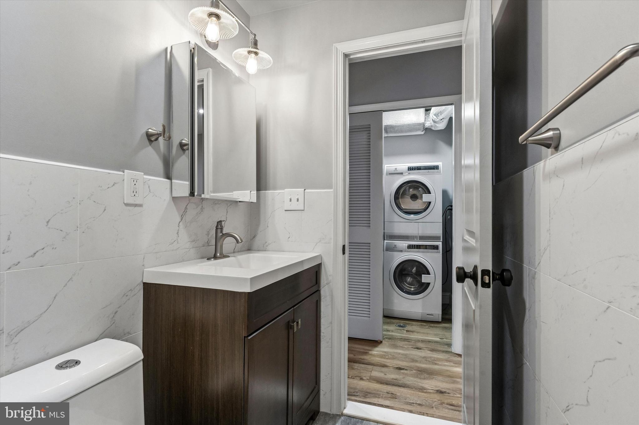 418 South 15th Street, Unit 2F Philadelphia, PA 19146 - Photo 8 of 16 a bathroom with a sink a toilet and shower