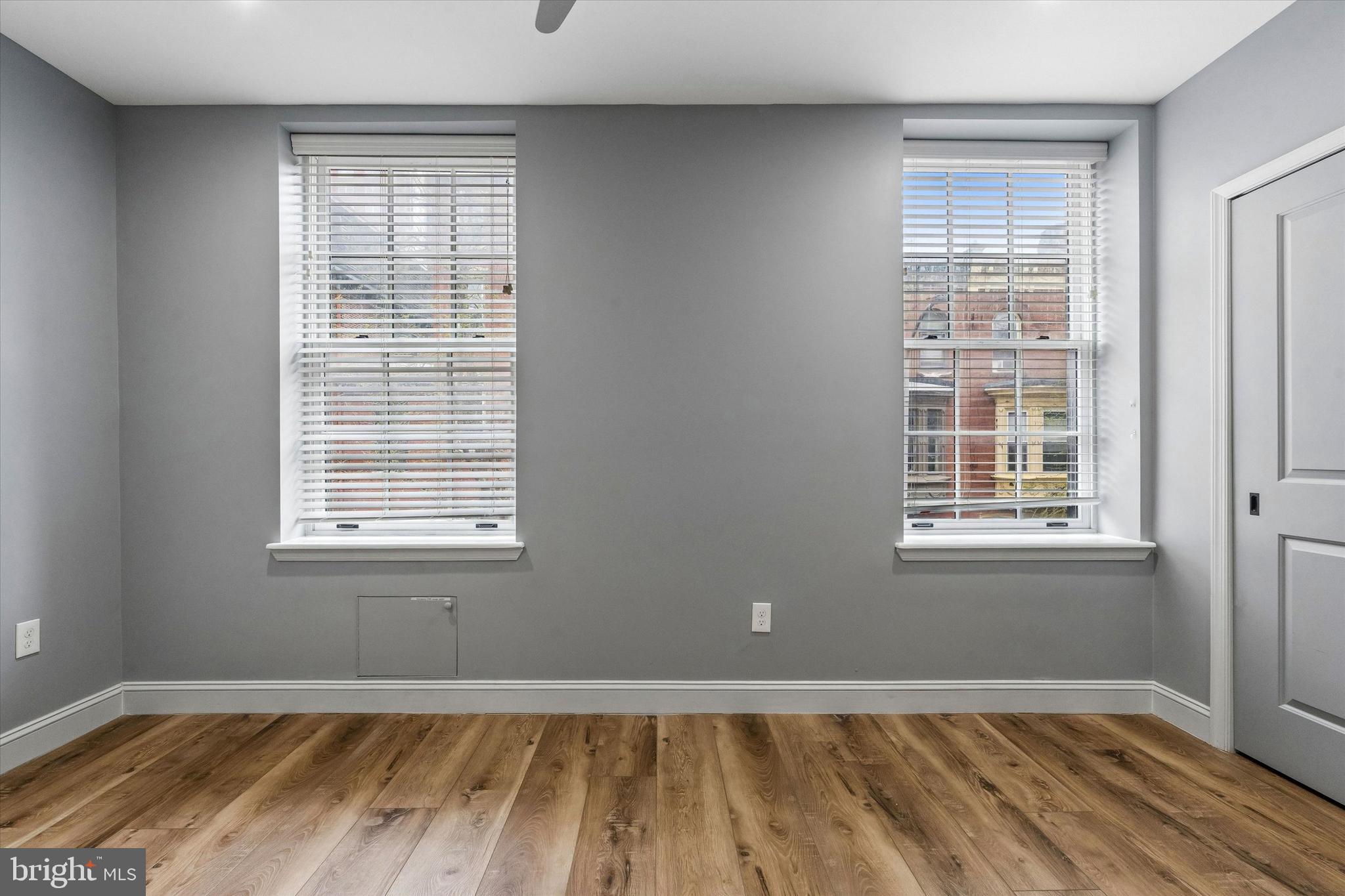 418 South 15th Street, Unit 2F Philadelphia, PA 19146 - Photo 9 of 16 a view of an empty room with wooden floor and a window