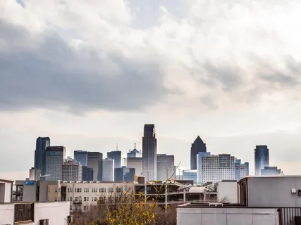 a view of a city with tall buildings in the background