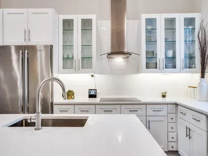a kitchen with granite countertop a sink and wooden cabinets