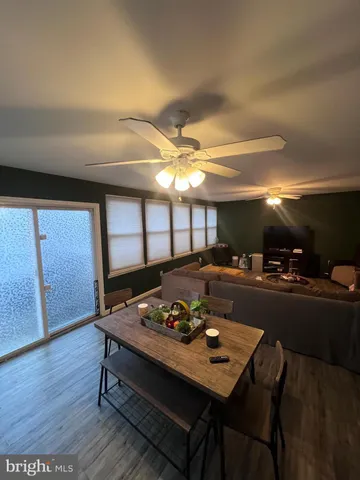 a dining room with furniture and window