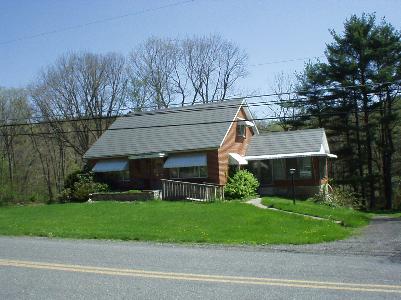 2930 57 Road Kunkletown, PA 18058 - Photo 1 of 11 a front view of house with garage and trees
