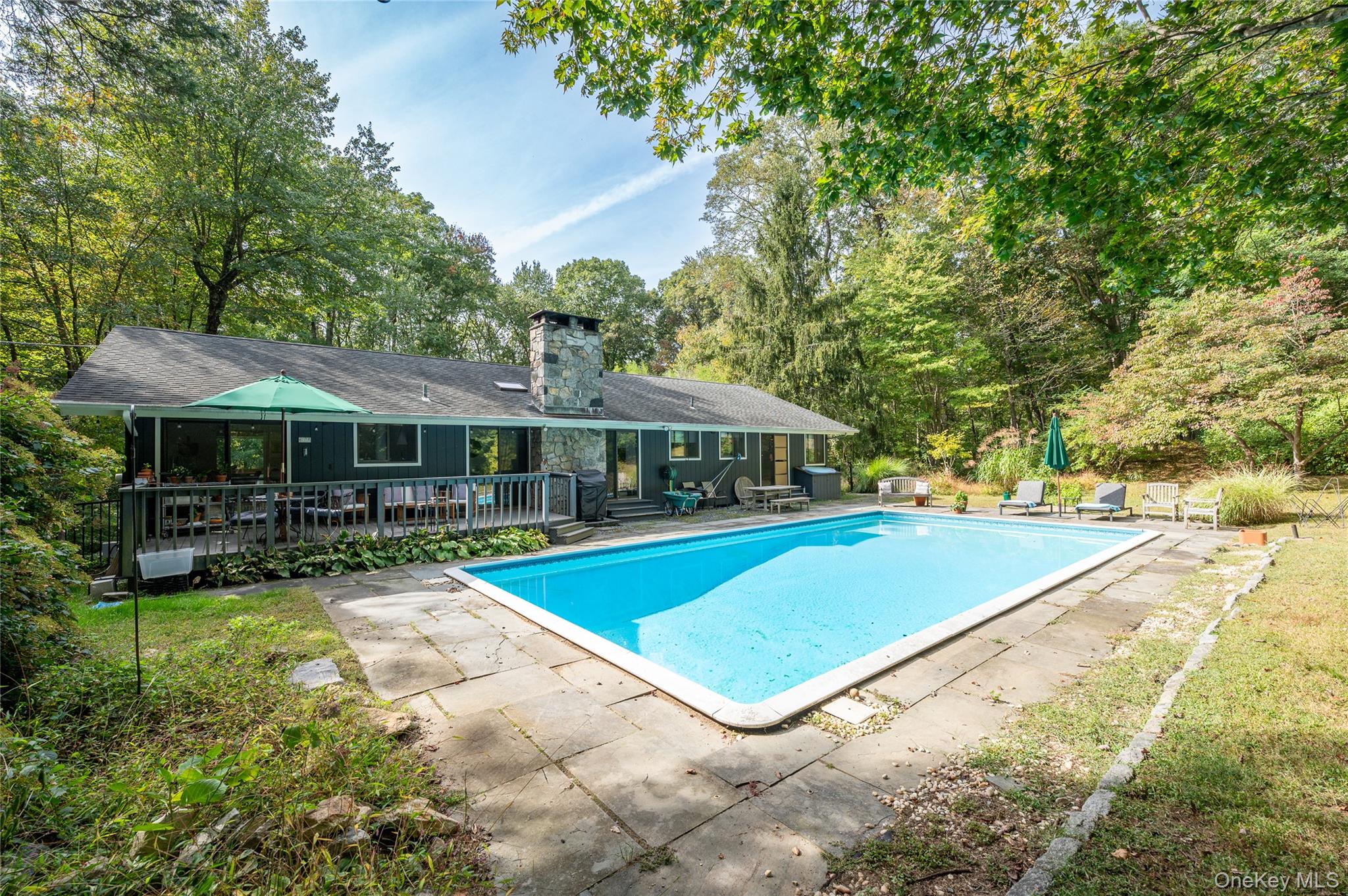29 Alice Road Mount Kisco, NY 10549 - Photo 24 of 24 Outdoor pool rear view of home