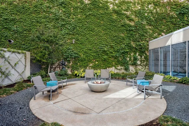 an outdoor sitting area with a couch