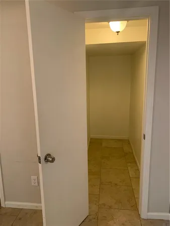 a kitchen with a refrigerator and a stove