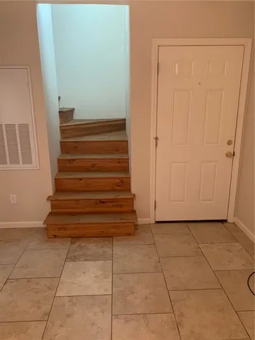 a kitchen with a refrigerator and a stove