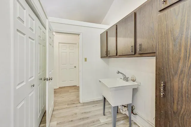 a bathroom with a sink and mirror