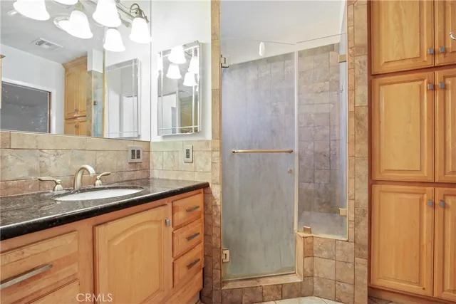 a bathroom with a bathtub and shower