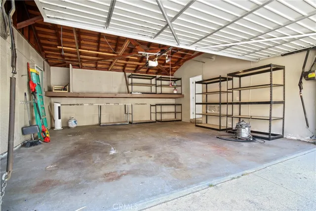 a view of a house with swimming pool and sitting area