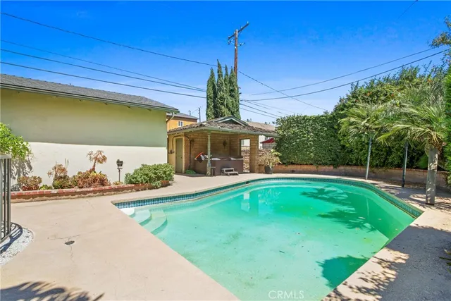 a view of a house with a yard and tree s
