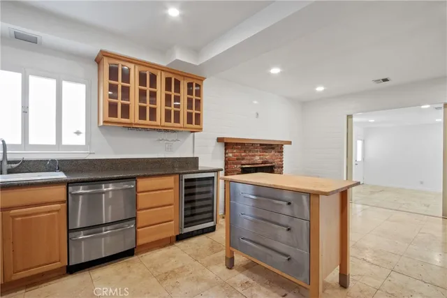 a kitchen with stainless steel appliances granite countertop a stove and a sink