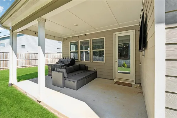 a living room with furniture and garden