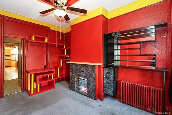 a kitchen with a stove a refrigerator and windows