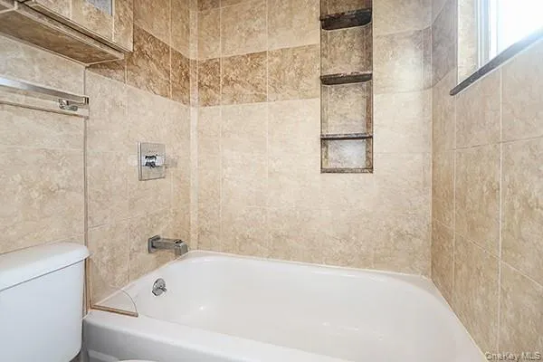 a kitchen with a refrigerator and a stove top oven