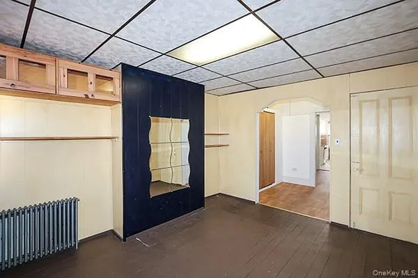a room with closet and wooden floor