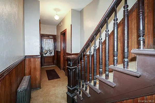 a view of staircase with lots of gym equipment