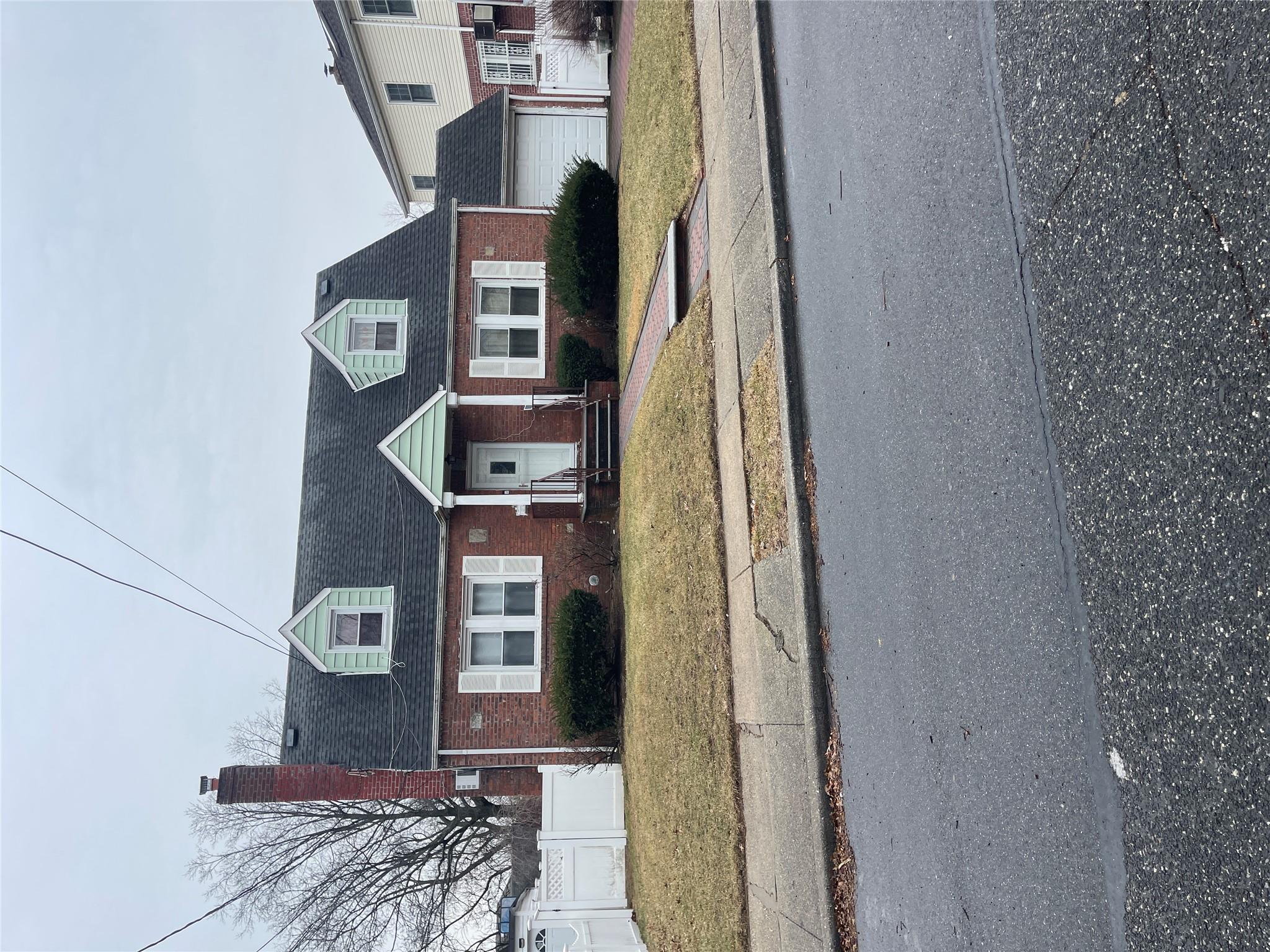 58 Dewitt Street Valley Stream, NY 11580 - Photo 1 of 1 Cape cod home featuring a front lawn