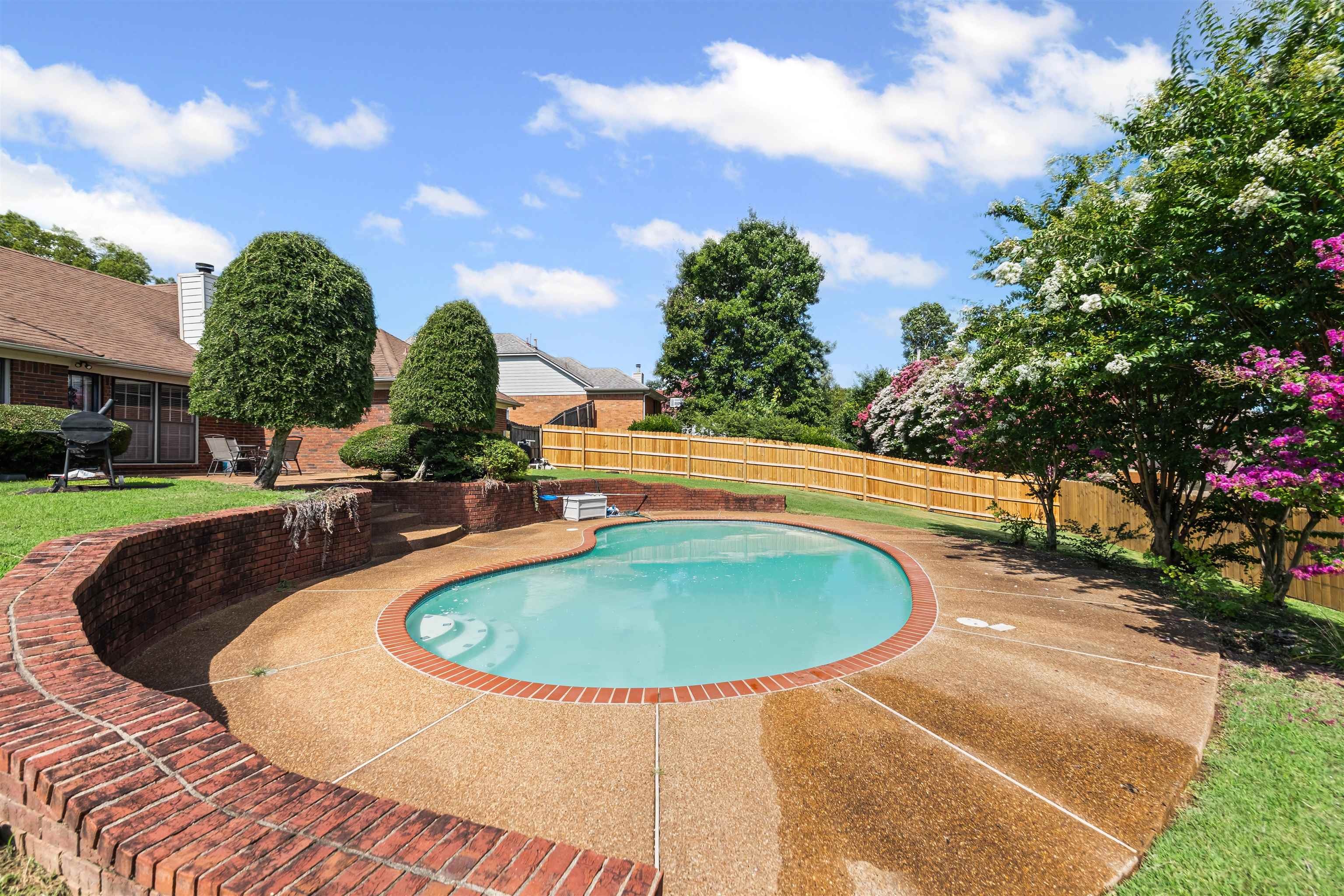 8645 Bazemore Road Memphis, TN 38018 - Photo 24 of 28 View of pool with a fenced backyard, a grill, and a patio area