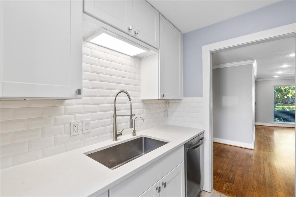 3012 Mahanna Springs Drive, Unit A Dallas, TX 75235 - Photo 12 of 29 a kitchen with a sink and a stove top oven