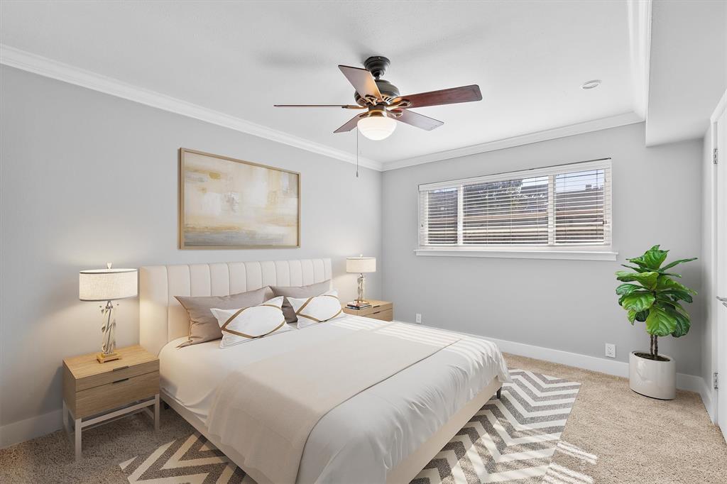 3012 Mahanna Springs Drive, Unit A Dallas, TX 75235 - Photo 13 of 29 a bedroom with a bed and a potted plant