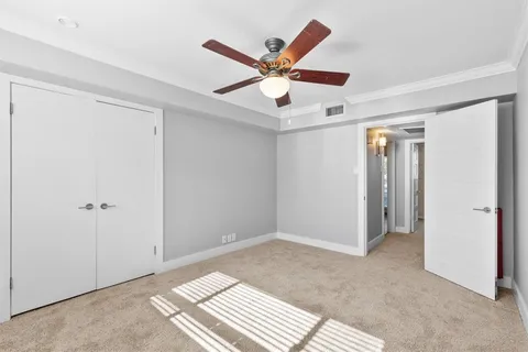 a view of workspace with window and ceiling fan
