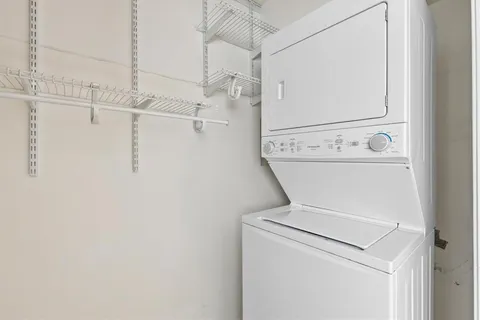 a view of a street with car parked on the road