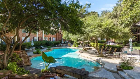 a view of a backyard with sitting area