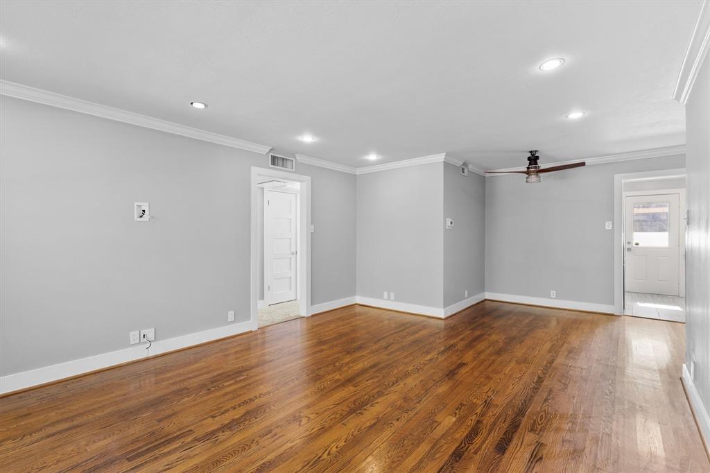 3012 Mahanna Springs Drive, Unit A Dallas, TX 75235 - Photo 7 of 29 a view of an empty room with wooden floor