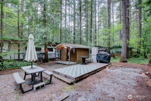 a view of a backyard with furniture